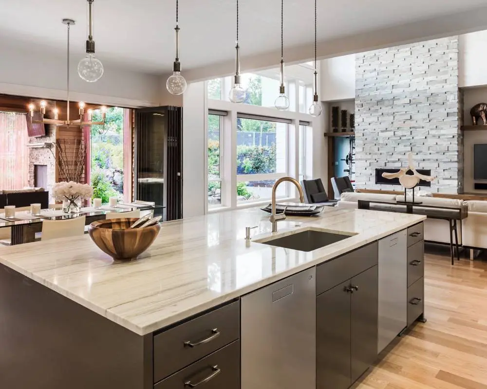 A kitchen with a large island and lots of counter space.